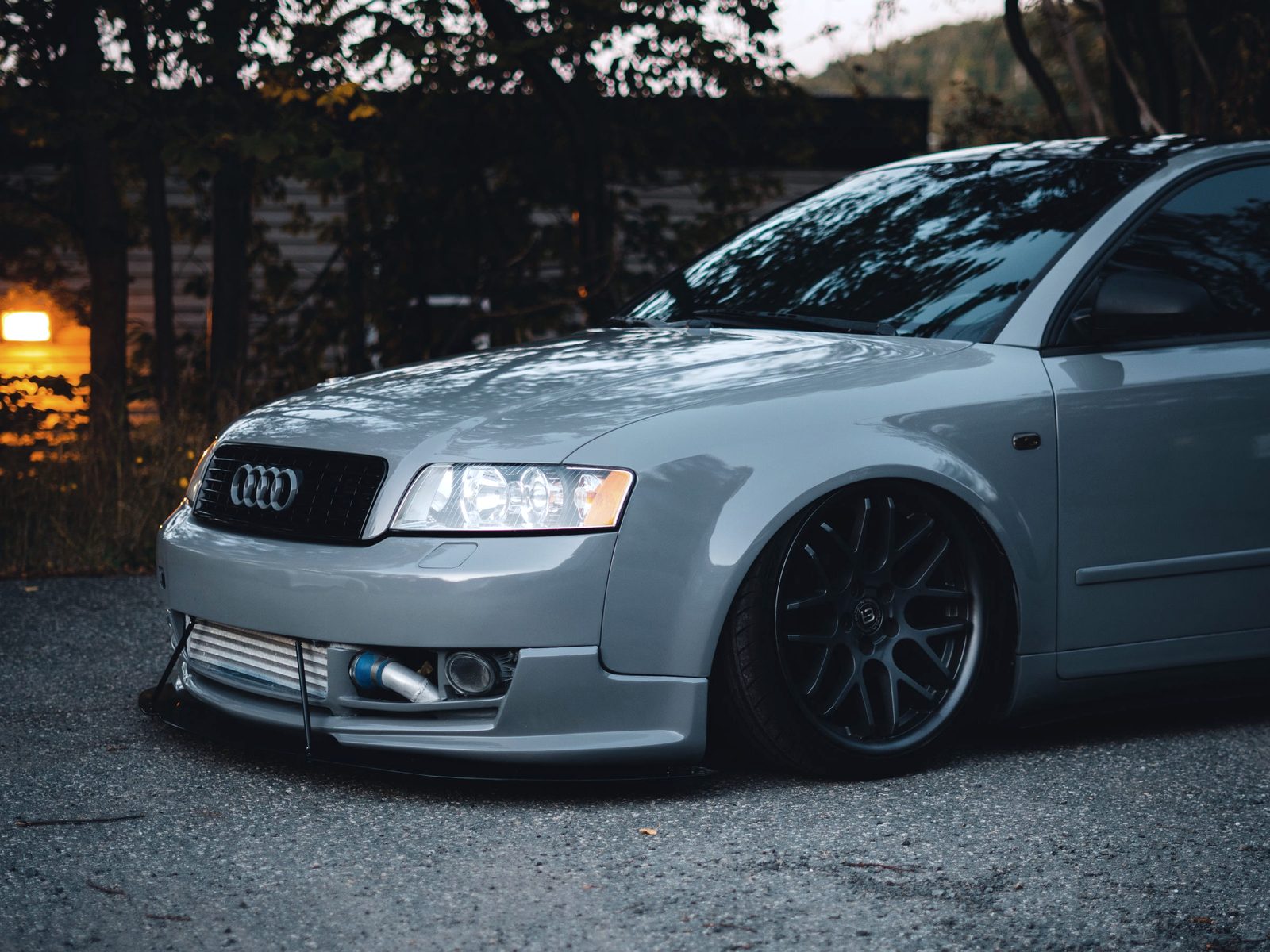 Lowered gray Audi sedan on black mesh-style wheels